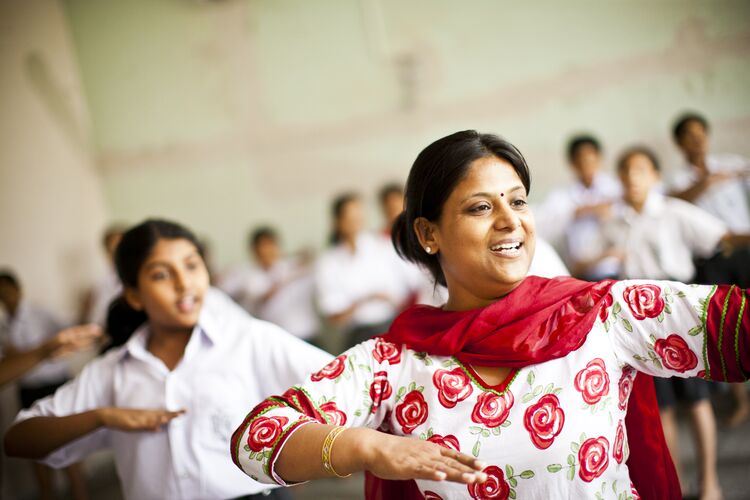 Teacher and student dancing