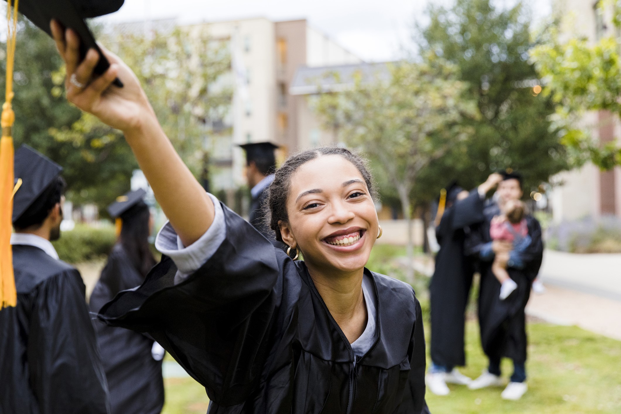 Young woman celebrating her graduation from university