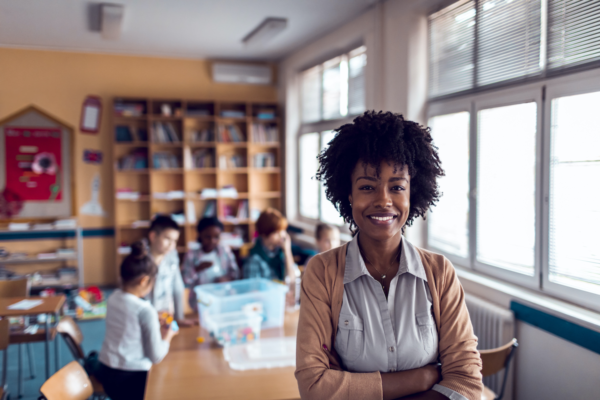 Smiling teacher in her classroom