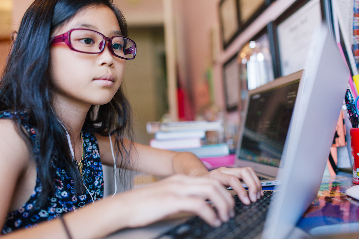 Girl wearing glasses at laptop