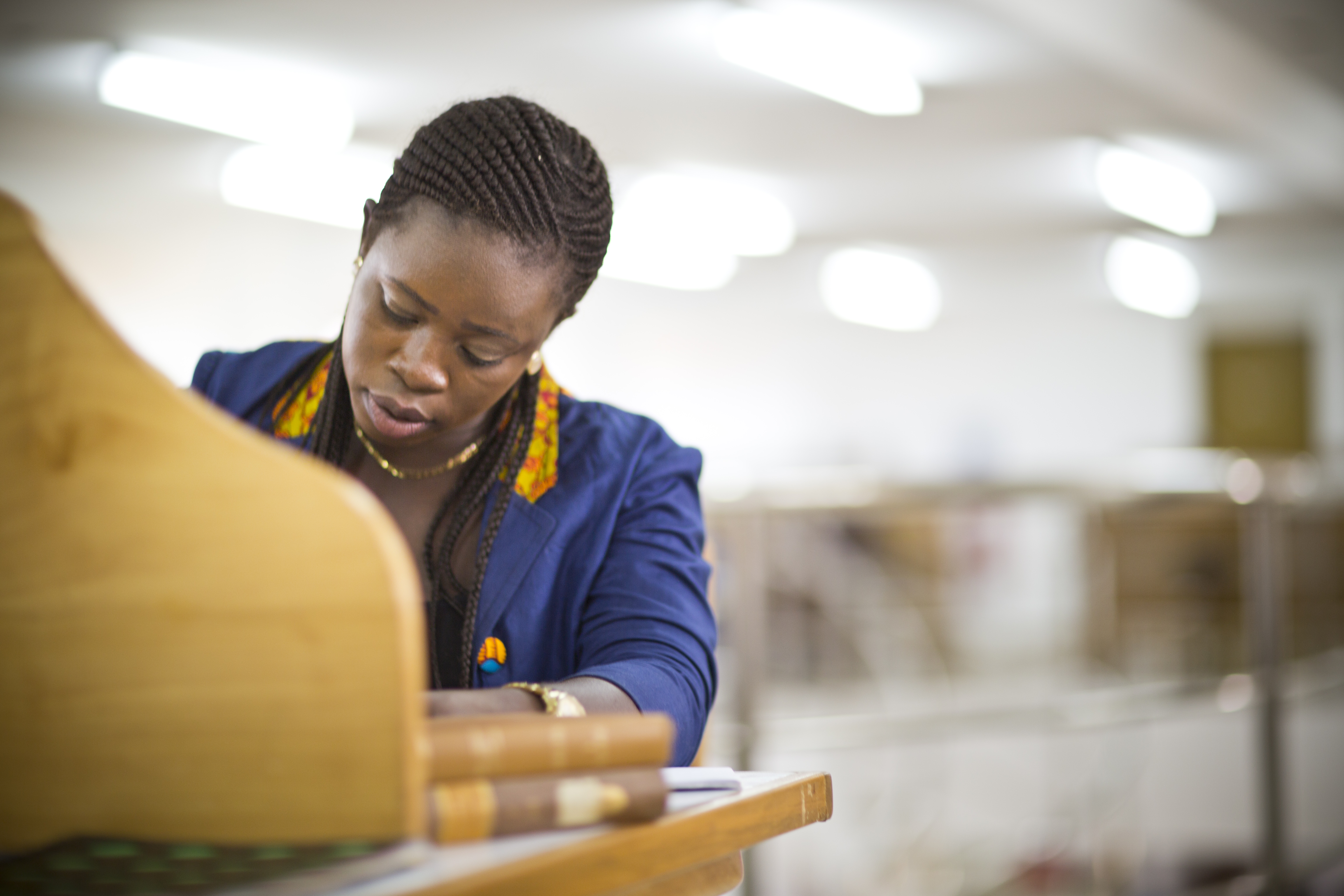 Young black woman studying in a university library