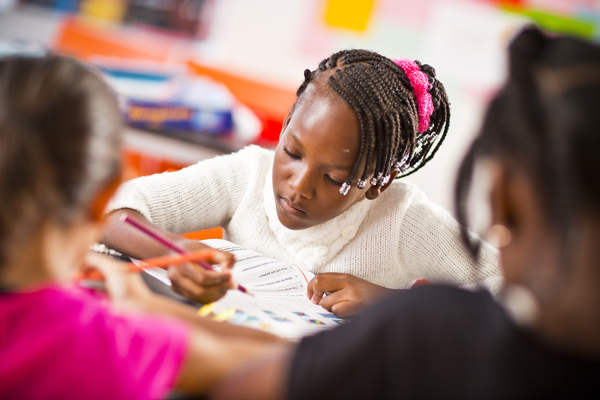 Young learner underlining a text