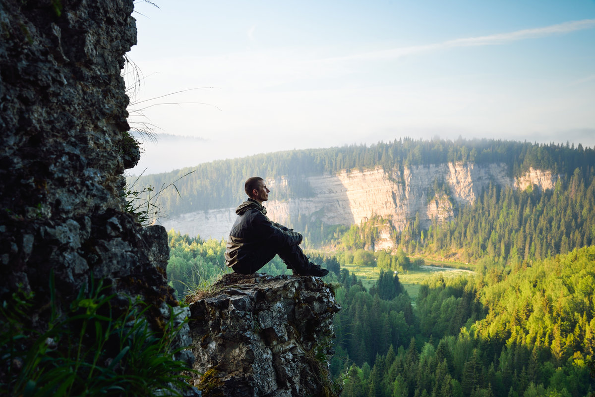 A man sitting and looking at nature