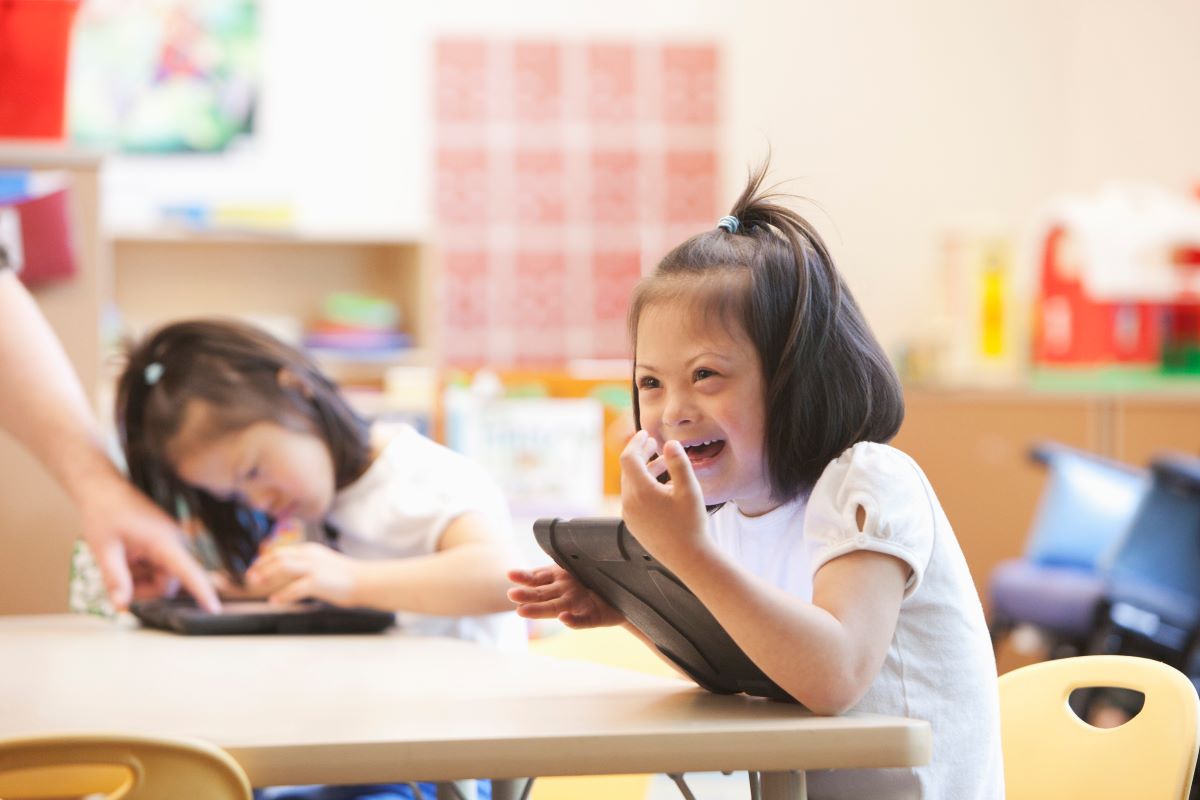 Asian girl in primary school using a tablet