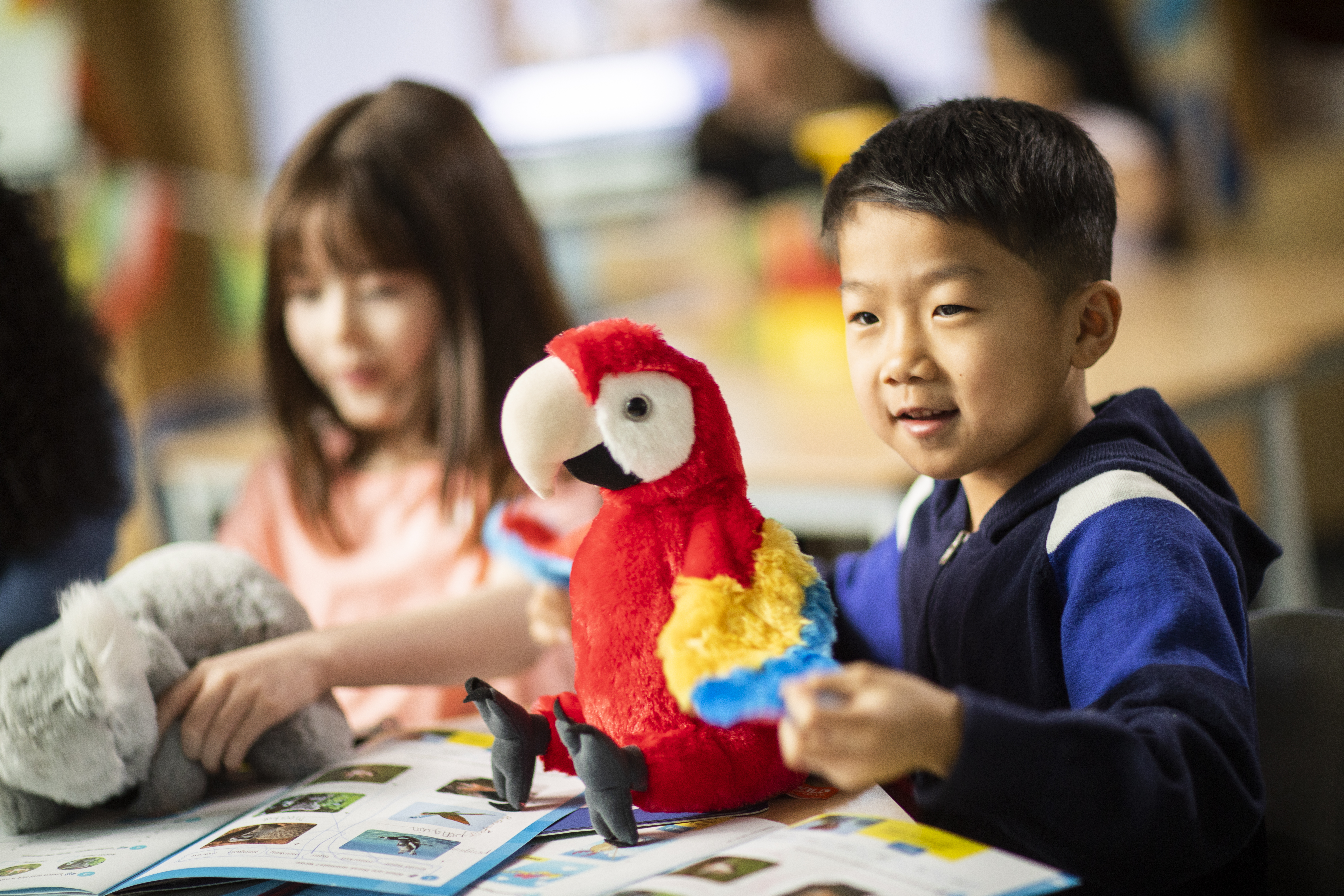 young learners with soft toy animals