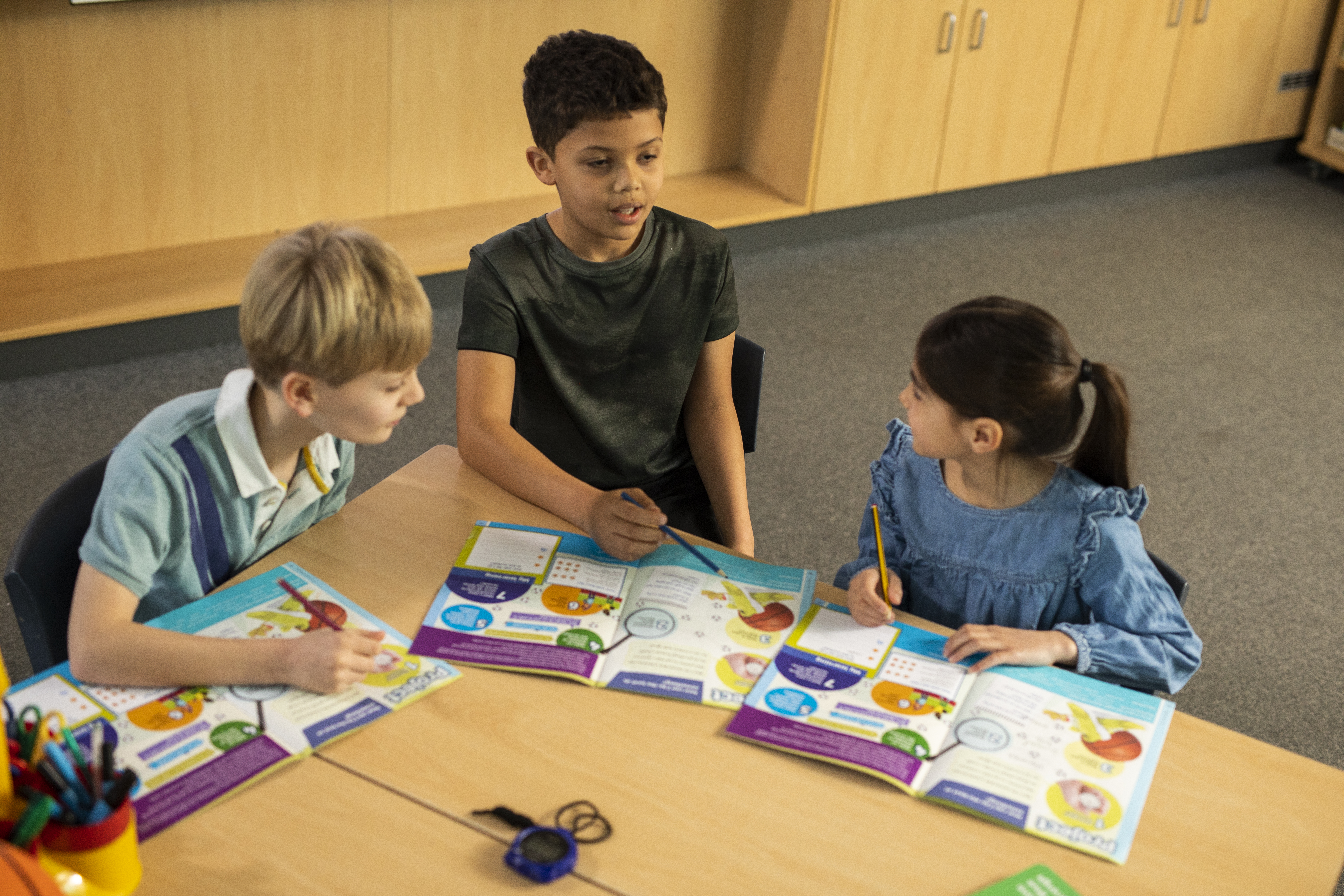 young learners working together on a language task