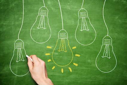 a series of lightbulbs drawn on a blackboard