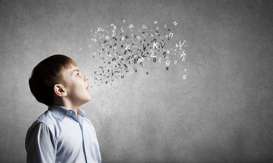 Boy speaking with letters appearing from mouth