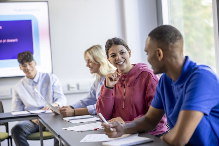 Adults learners speaking in a classroom