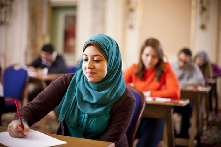 Learner in Egypt doing a language exercise at a desk