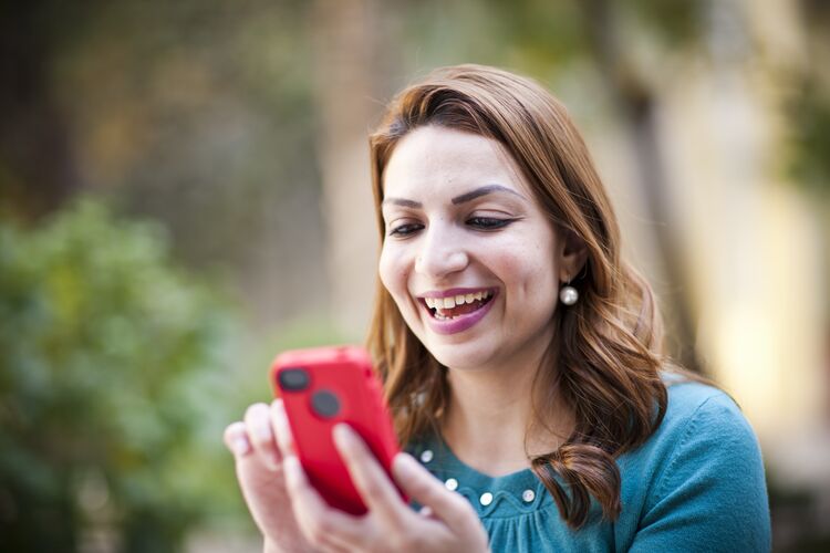 woman looking at mobile phone