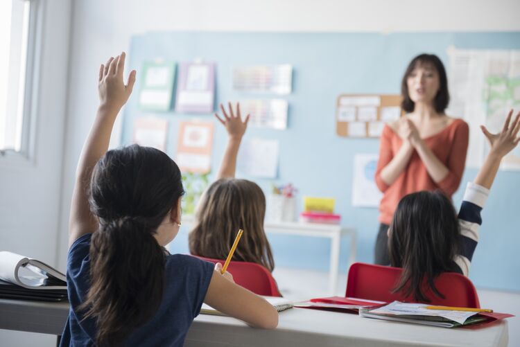 Female teacher in front of her class