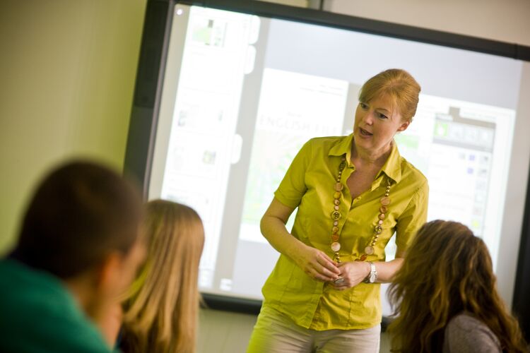 A teacher in Italy talking to her students in class