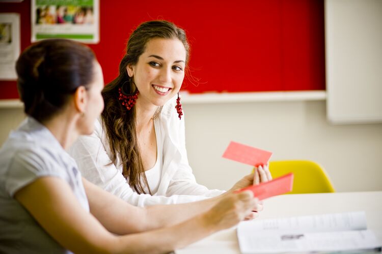 Two students looking at vocabulary cards