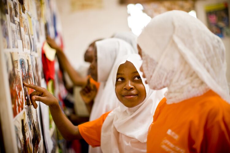 Students in Kenya looking at images on a whiteboard