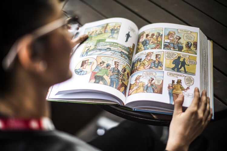 Woman looking at a graphic novel