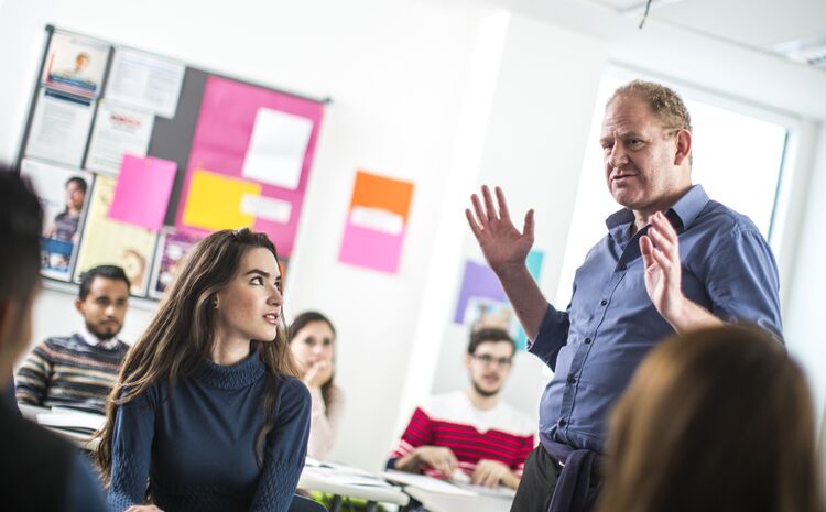 Man teaching English to students in Mexico