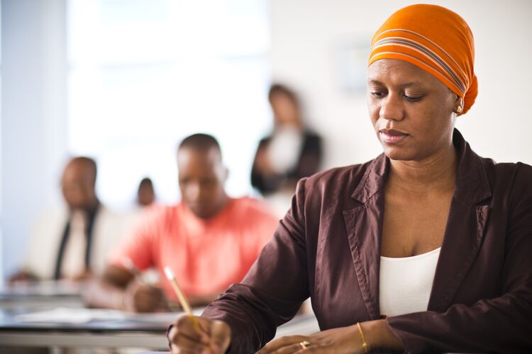 Woman taking a test in a classroom