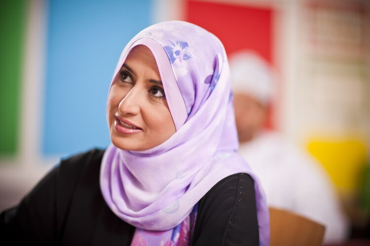 Learner in Oman looking up at teacher