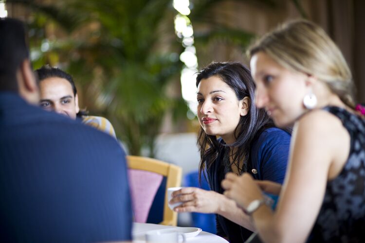 A group of students sitting together in a cafe