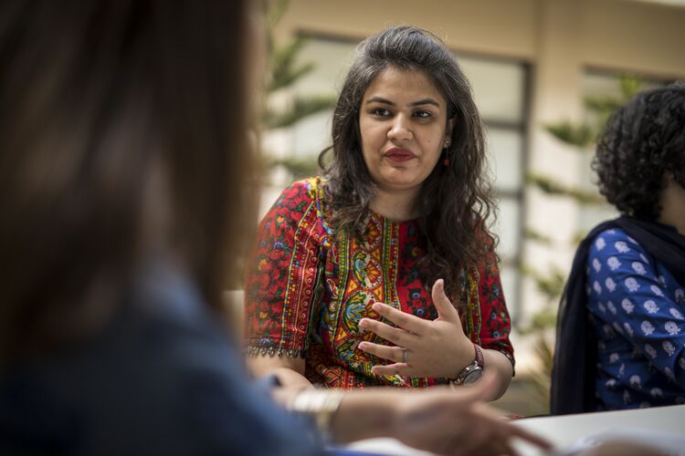 Two women talking together