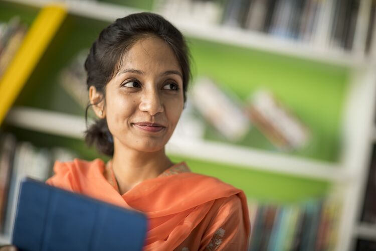 A teacher in a library