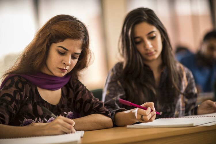 Two students studying in Pakistan classroom