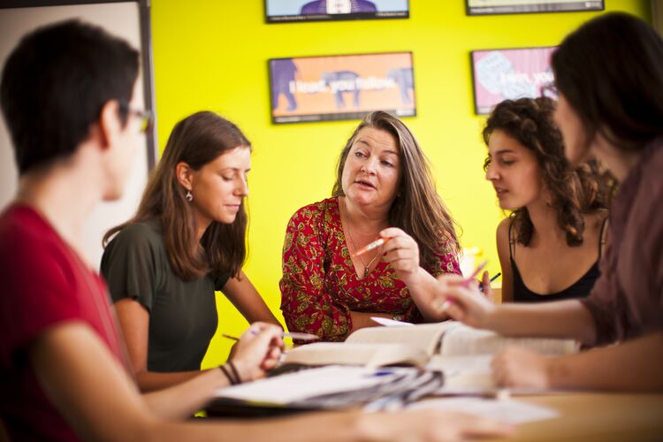 Teacher talking to a group of students