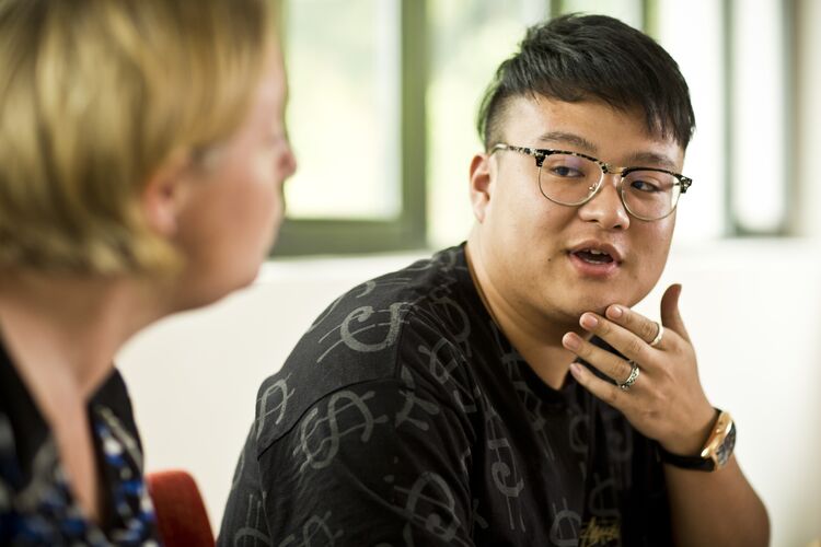 student chatting to a classmate