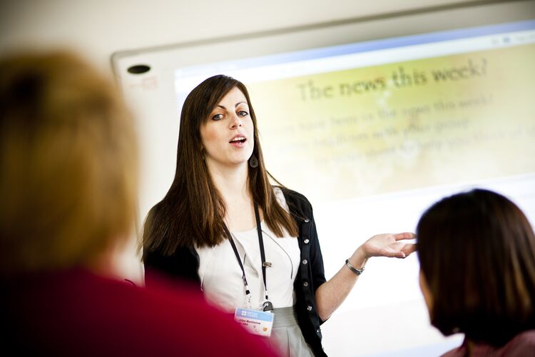 Teacher in South Korea explaining something to learners 