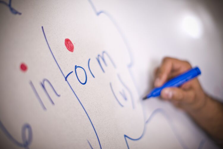 A word on a whiteboard with the stress patterned highlighted