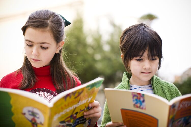 Two  young students in Spain reading books