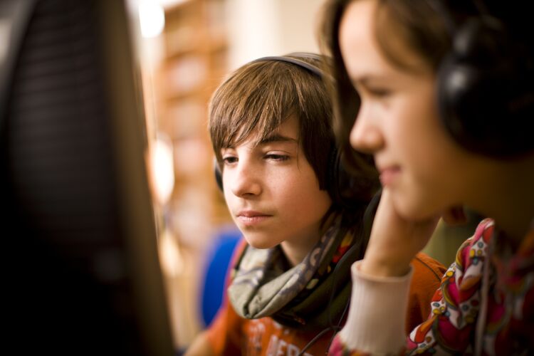 boy and girl playing a computer game