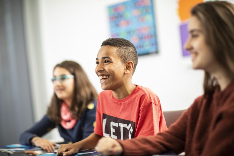 Spanish learners laughing in the classroom