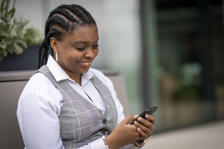 woman looking at mobile phone