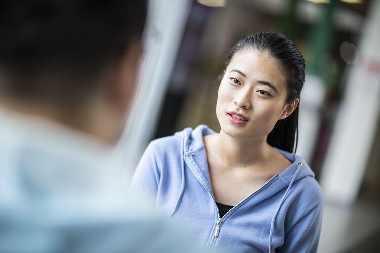 Two Chinese students speaking together