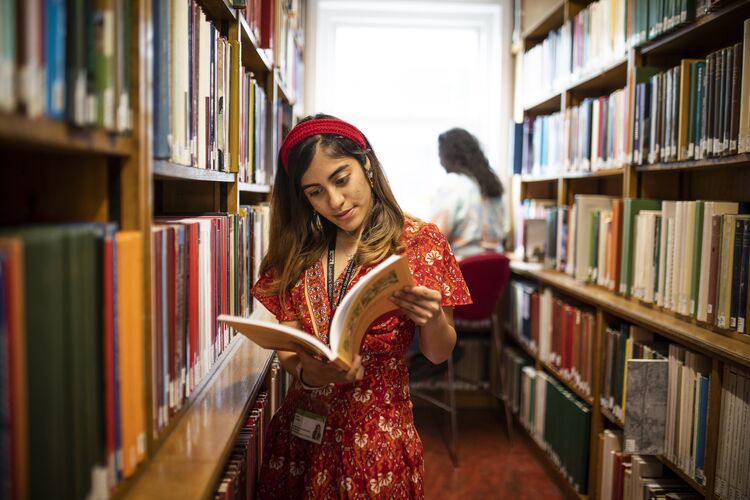 Woman reading in a library