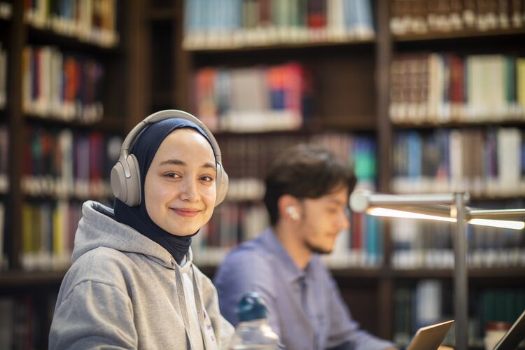 student studying with headphones on