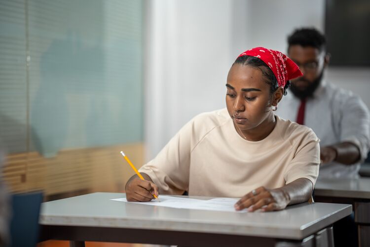 Student in Sudan taking a test