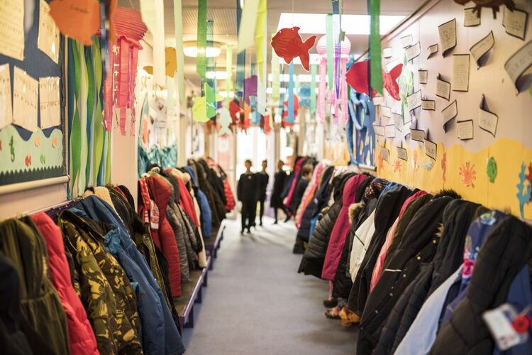 Coats hung up in a colourful UK school