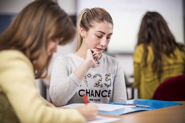 Students in the Ukraine reading a text