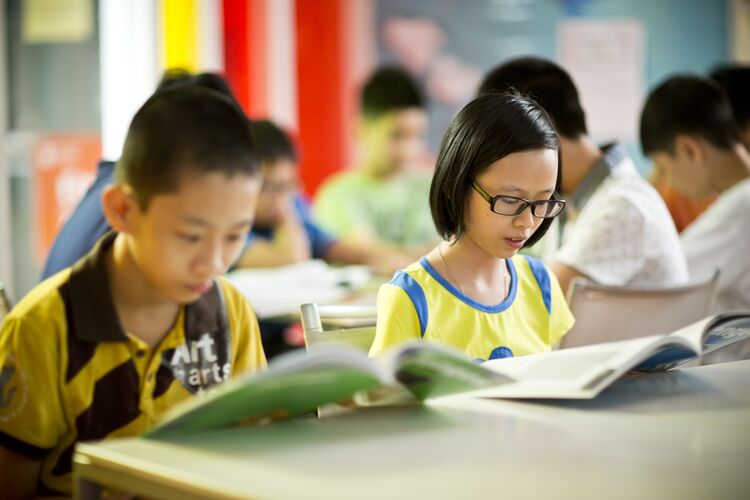 Two students reading texts