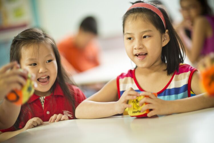 Young learners in Vietnam using dice in the classroom