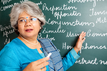 A teacher in front of a board