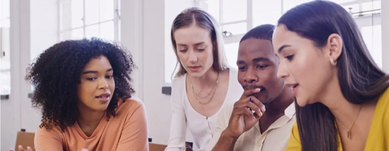 Diverse group of teachers talking together