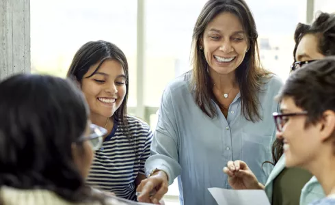 A teacher with a diverse group of learners in the classroom