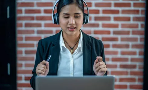 Asian woman giving a webinar